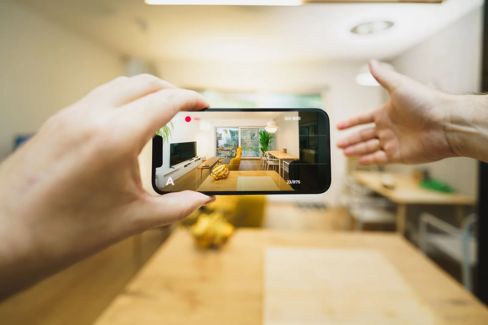 Interactive virtual tour of a contemporary living room using a smartphone. Real Estate Social Media Examples: Nine Patterns to Test